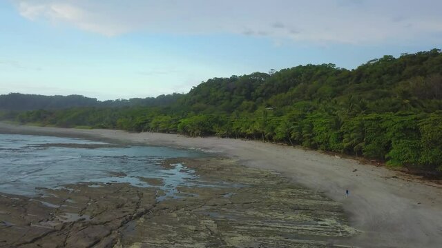 4k Costa Rica drone over beaches, jungle, beautiful oceans, and stunning sunsets. Travel, nature, vacation, paradise, coastal retreat, South American islands.