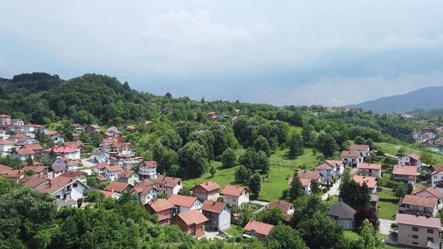 View over Tešanj in Bosnia & Herzegovina with hills in the background - Pan from left to right
