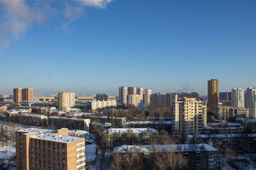 top panoramic view of the city with modern high residential buildings on a frosty winter sunny day against a clear blue sky and space to copy in Reutov Moscow Region Russia