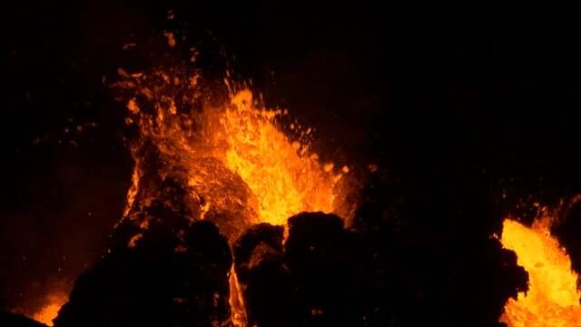 explosive fissure bursting with molten lava in hawaii