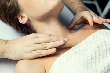 Male hands massage the female shoulders