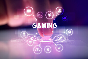 Finger touching tablet with web technology icons and GAMING inscription, web technology concept
