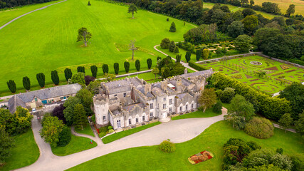 Fototapeta premium Aerial view Ardgillan Castle and Demesne is Ireland’s hidden gem. Set in spectacular parklands overlooking the Irish Sea with a magnificent view of the Mourne Mountains. 
