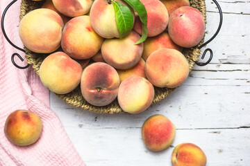 Ripe juicy peaches on a rustic background