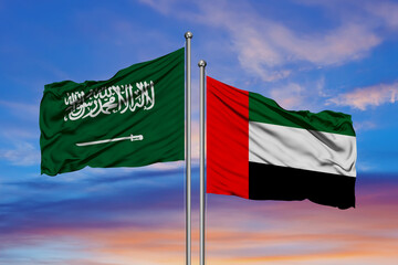 Saudi Arabia and United Arab Emirates, two flags waving against blue sky. 3d image