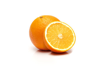 Whole and half sliced delicious and juicy ripe oranges isolated