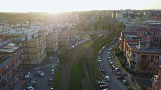 Cars Parked On Roadside Near Parco Degli Acquedotti And Ancient Aqueduct On A Sunny Morning In Rome, Italy. - aerial