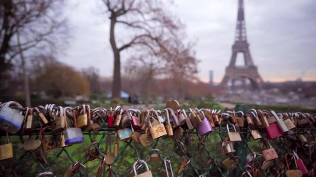 Love padlocks in Paris with view of the Eiffel Tower, romantic symbols in Paris, tourism in France