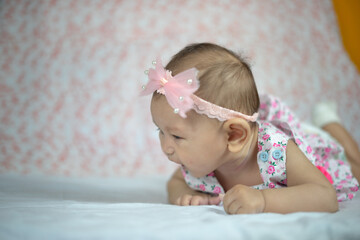 3 Month Old Asian Baby Girl Holding her head up at 45 degrees Child Development 3 month old baby girl