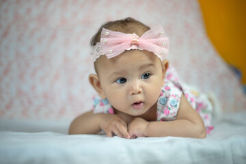 3 Month Old Asian Baby Girl Holding her head up at 45 degrees Child Development 3 month old baby girl