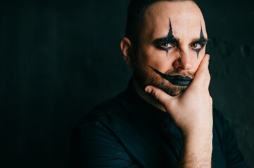 A portrait of gothic black clown