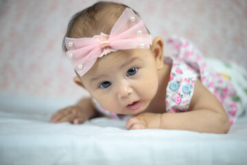 3 Month Old Asian Baby Girl Holding her head up at 45 degrees Child Development 3 month old baby girl