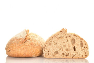 Two halves of a fragrant loaf without yeast with bran flakes, close-up, isolated on white.