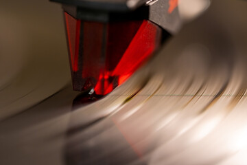 Close-up of Turntable Sound Pick-up With Needle playing a vinyl record
