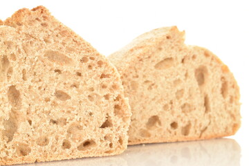 Two halves of a fragrant loaf without yeast with bran flakes, close-up, isolated on white.