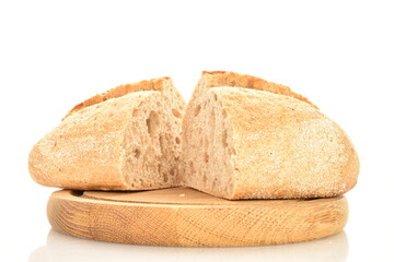 Two halves of a fragrant loaf without yeast with cereal with bran on a wooden tray, close-up, isolated on white.