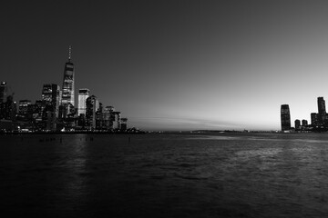 Black and White Photo of Dusk on the Hudson River between the New York City and Jersey City Skyline after a Sunset