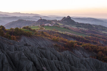 Rossena Castle and italian countryside badlands during sunset, Canossa