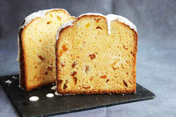 Half-sliced homemade sweet Easter bread. A piece of Easter Orthodox sweet bread, a cake. Close-up.
