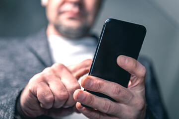 Close-up of a man using a smartphone