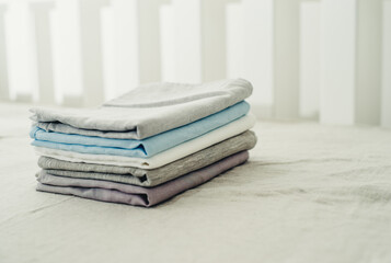 a set of clean and plain linens on the bed close-up