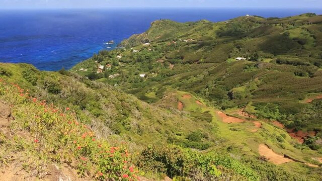 Passing clouds over the Adamstown on Pitcairn Island suggests passing time over this place