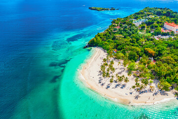 Aerial drone view of the beautiful small island and palm trees of Atlantic Ocean. Cayo Levantado...
