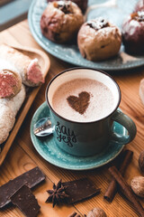 Cup of coffee on wooden table.
