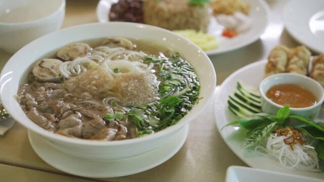 Delicious Bowl Of Pho Soup With Vietnamese Dish. - close up