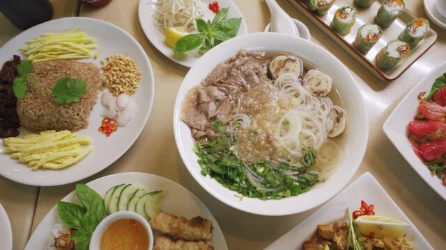 Set Of Delicious Vietnamese Cuisine Served On Restaurant's Table. - dolly shot
