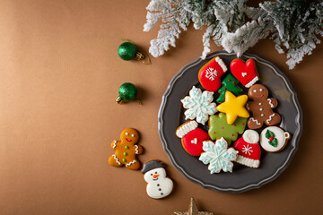 Overhead view of gingerbread cookie and holiday decorations
