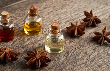 Bottles of essential oil with star anise