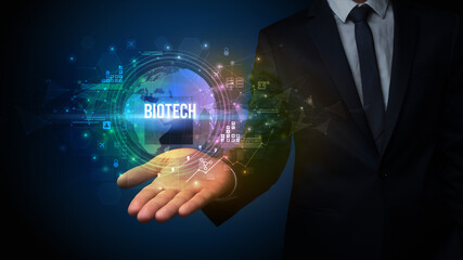 Elegant hand holding BIOTECH inscription, digital technology concept