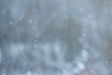 Abstract blurred illustration. bokeh background.  Defocused white lights and snow