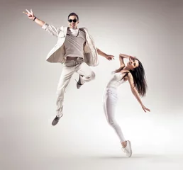 Foto op Canvas Talented couple dancing in a bright studio © konradbak