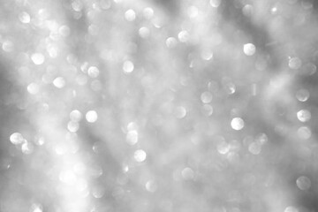 Trendy abstract silver gray circles bokeh festive glitter background. Christmas lights bokeh...