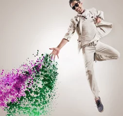 Zelfklevend Fotobehang Conceptual picture of a jumping dancer throws paint drops © konradbak