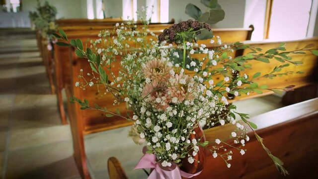 Flowers decorate a wedding chapel.