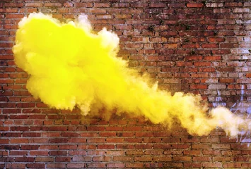 Deurstickers Yellow, dense fume on the brick wall background © konradbak