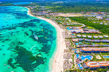 Aerial drone view of Bavaro Beach, Punta Cana resort in Dominican Republic. Travel and vacation background - obrazy, fototapety, plakaty