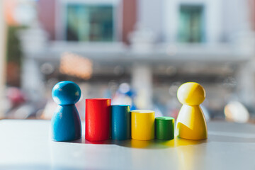 Wooden people symbol with colorful block using as education and business concept