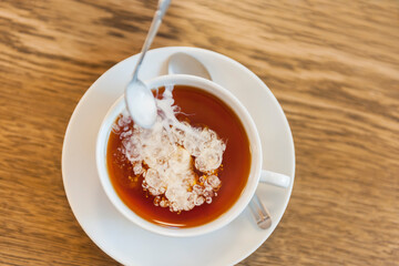 Tea with nice cream clouds from the spoon