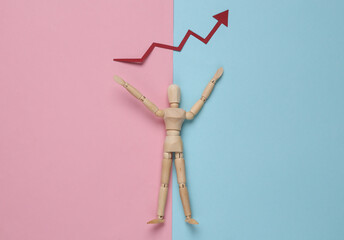 Wooden puppet mannequin holding a growth arrow on pink blue pastel background. Economic rise, business concept