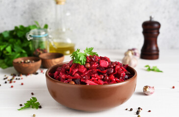 Traditional Russian salad with beets. The vinaigrette. Root vegetable salad.