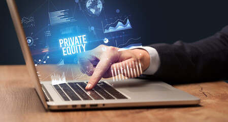 Businessman working on laptop with PRIVATE EQUITY inscription, new business concept