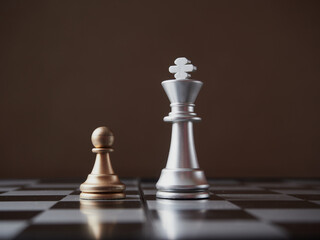 wood chess pieces on board game. brown vintage background