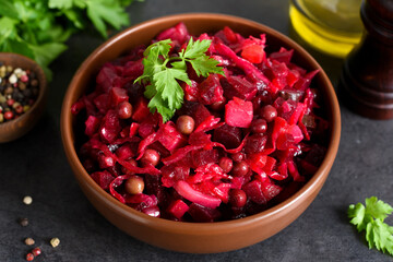 Traditional Russian salad with beets. The vinaigrette. Root vegetable salad.