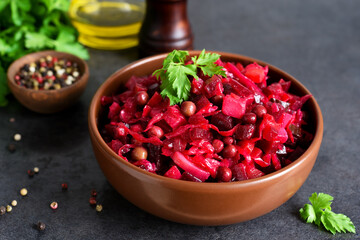 Traditional Russian salad with beets. The vinaigrette. Root vegetable salad.