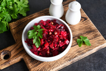 Traditional Russian salad with beets. The vinaigrette. Root vegetable salad.
