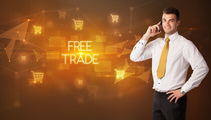 Businessman with shopping cart icons and FREE TRADE inscription, online shopping concept